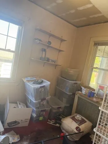 a bathroom with a toilet and a window