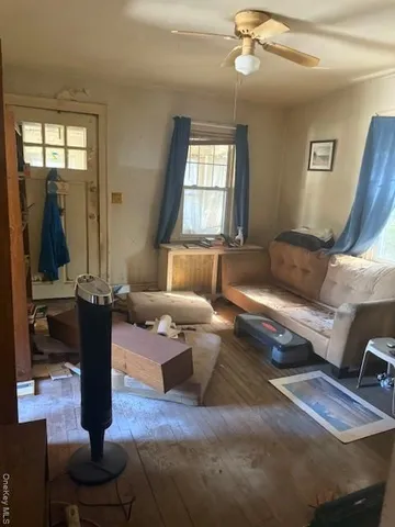 a living room with furniture and a window