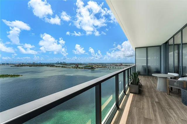 a view of a balcony with chair and table