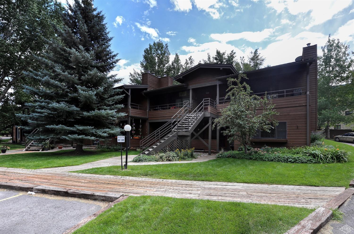 165 Gopher Road, Unit E28 Avon, CO 81620 - Photo 12 of 19 a front view of a house with a yard