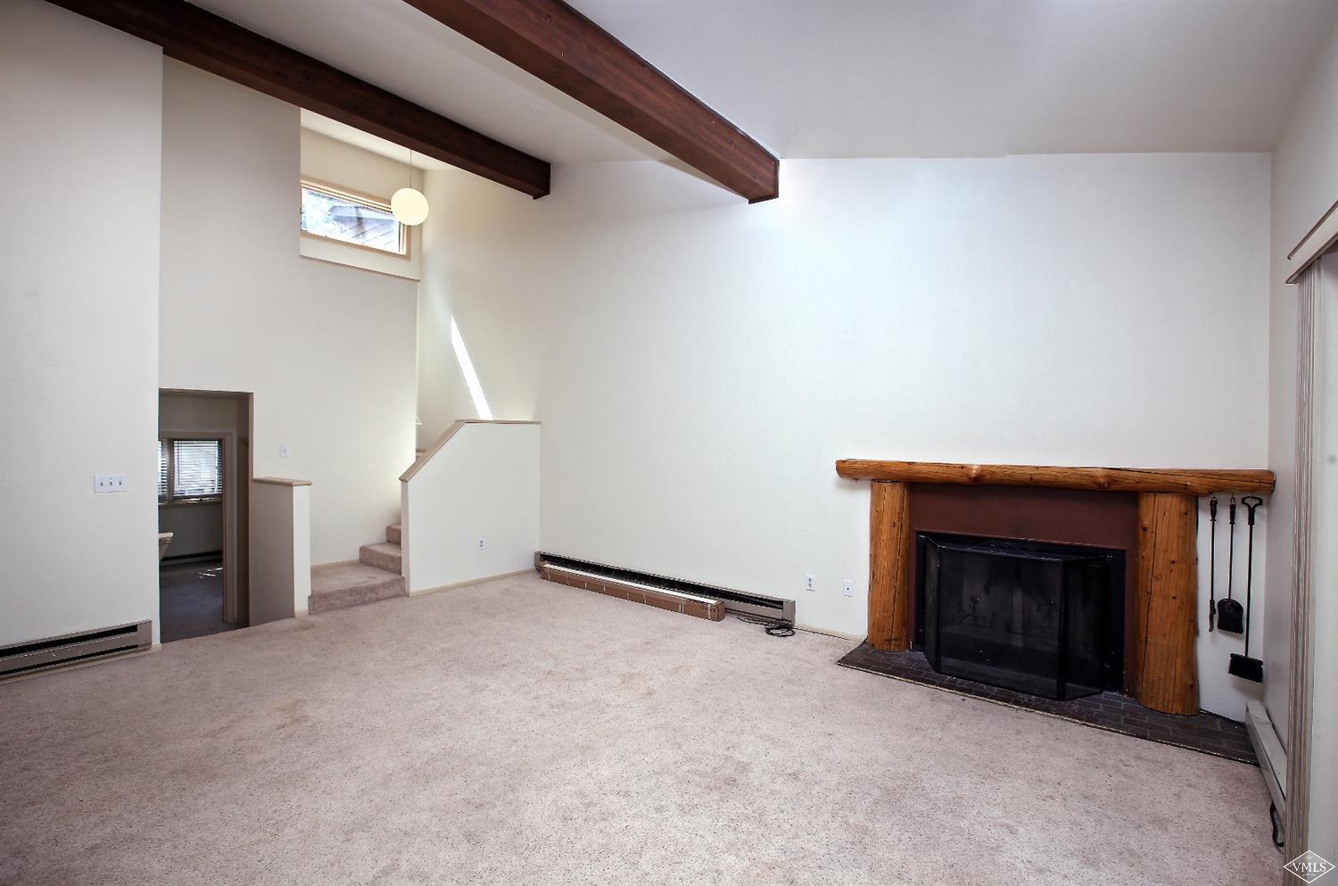 165 Gopher Road, Unit E28 Avon, CO 81620 - Photo 3 of 19 a view of empty room with fireplace