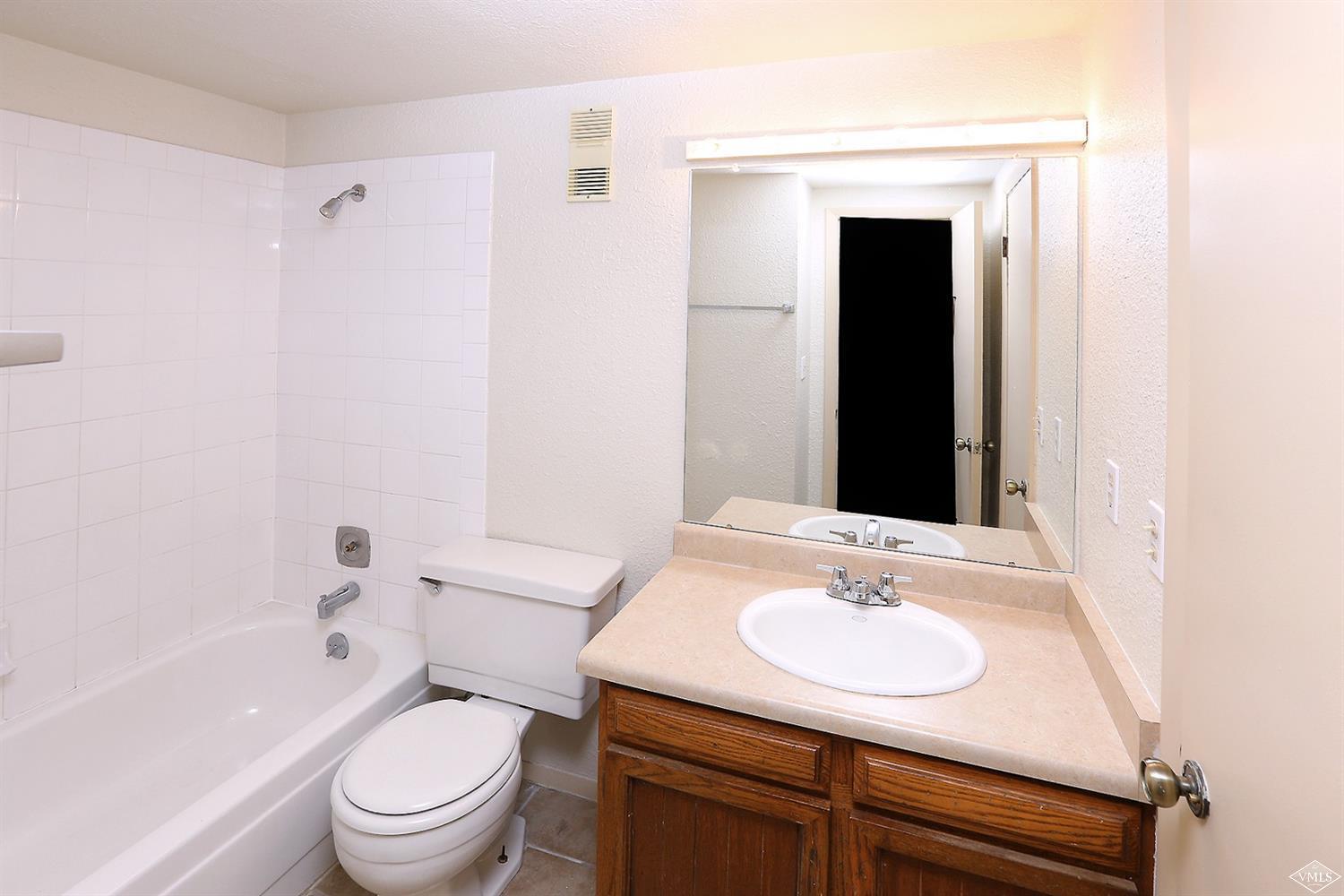 165 Gopher Road, Unit E28 Avon, CO 81620 - Photo 9 of 19 a bathroom with a sink toilet and shower