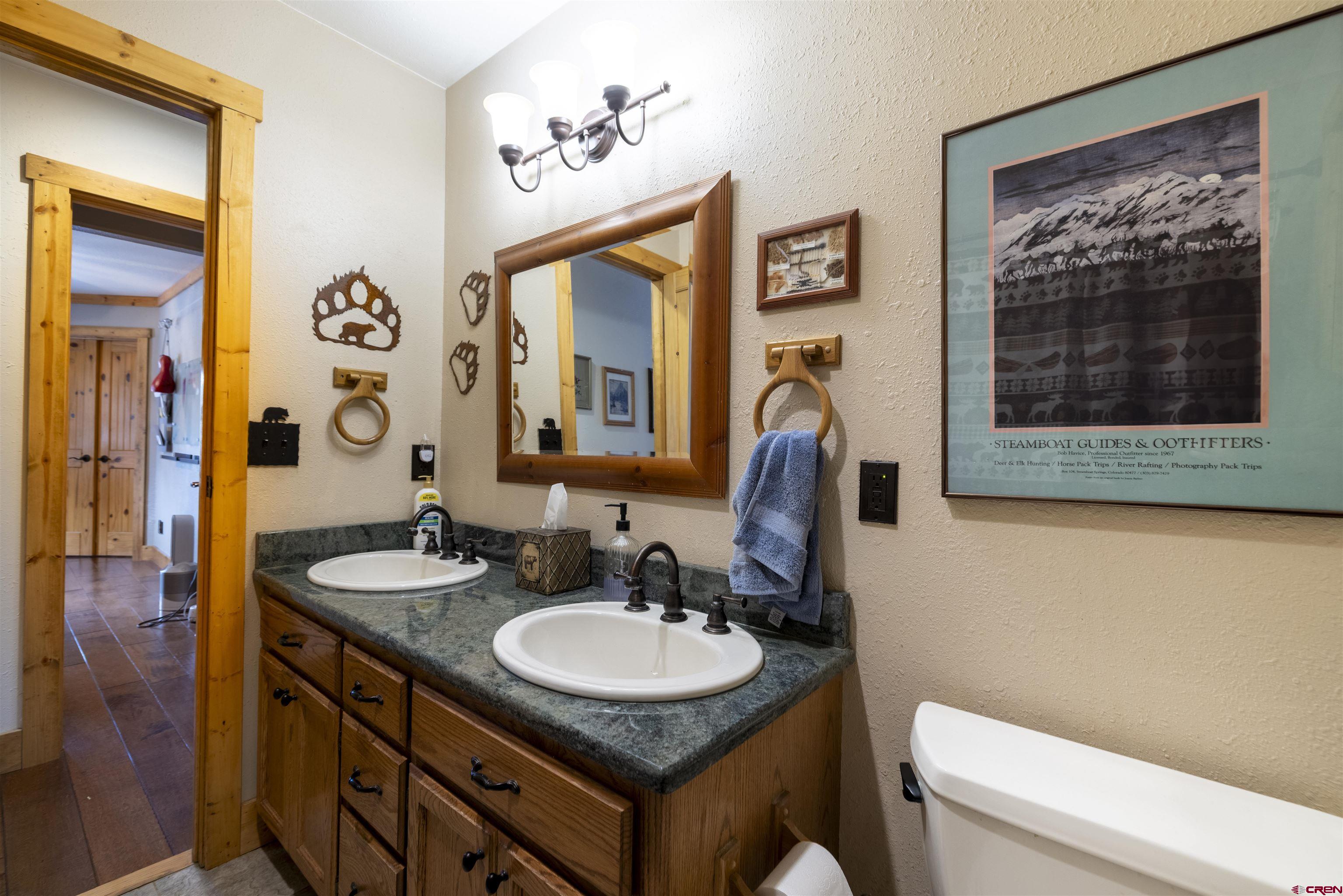 250 Sunset Lane Durango, CO 81301 - Photo 22 of 44 a bathroom with a sink a toilet and a mirror