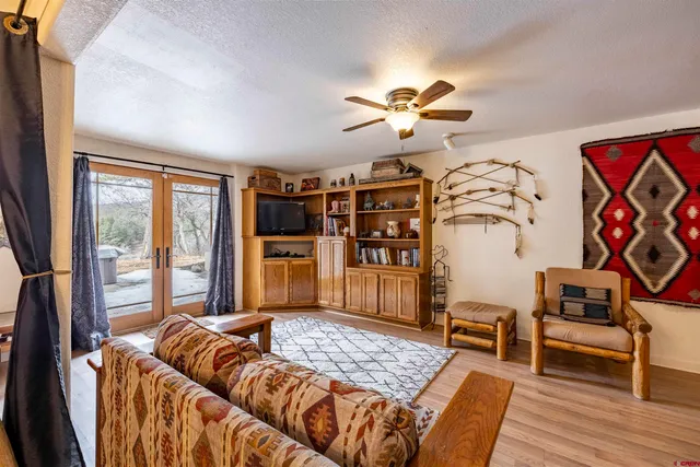 a bedroom with furniture and wooden floor