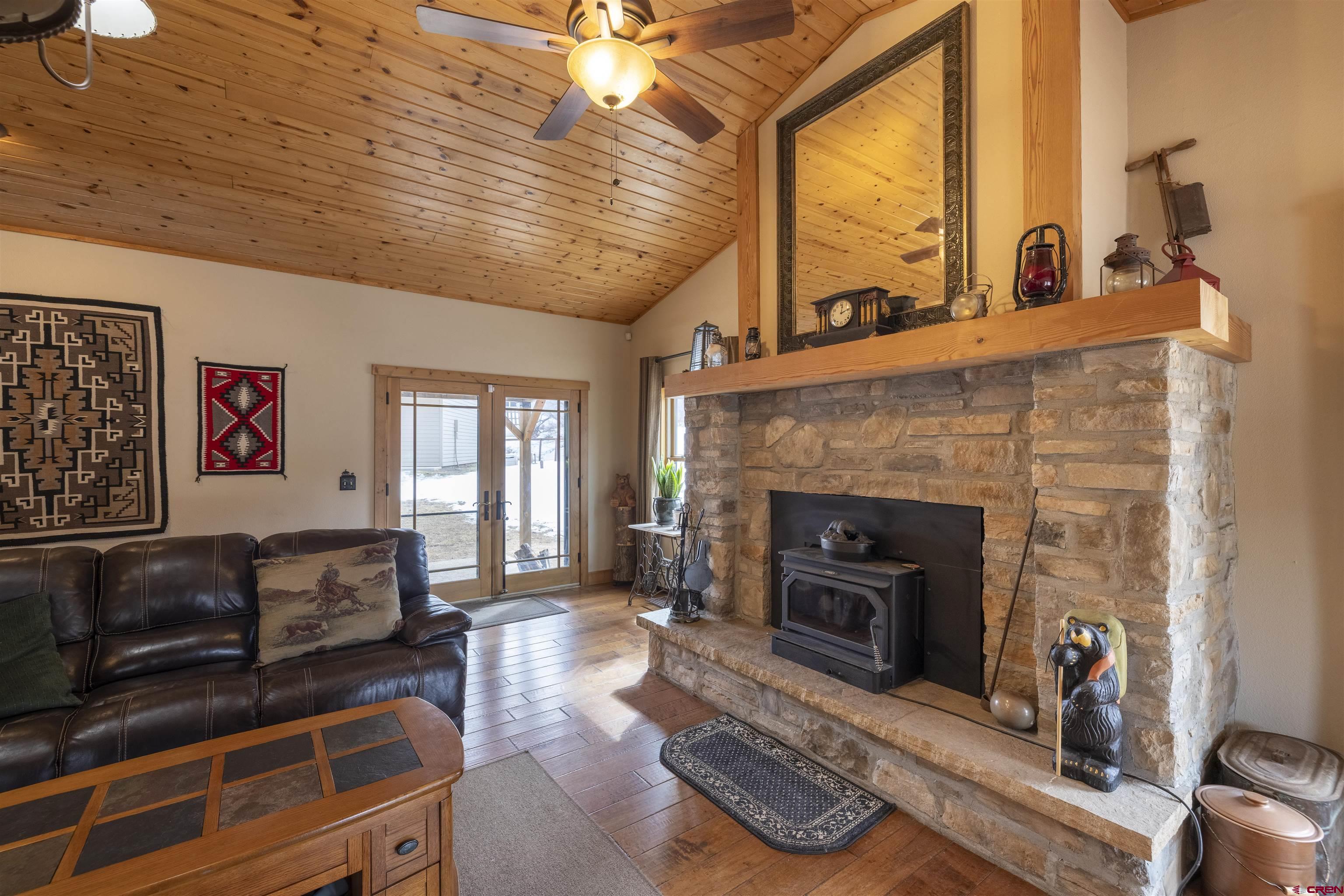 250 Sunset Lane Durango, CO 81301 - Photo 3 of 44 a living room with furniture a fireplace and a table