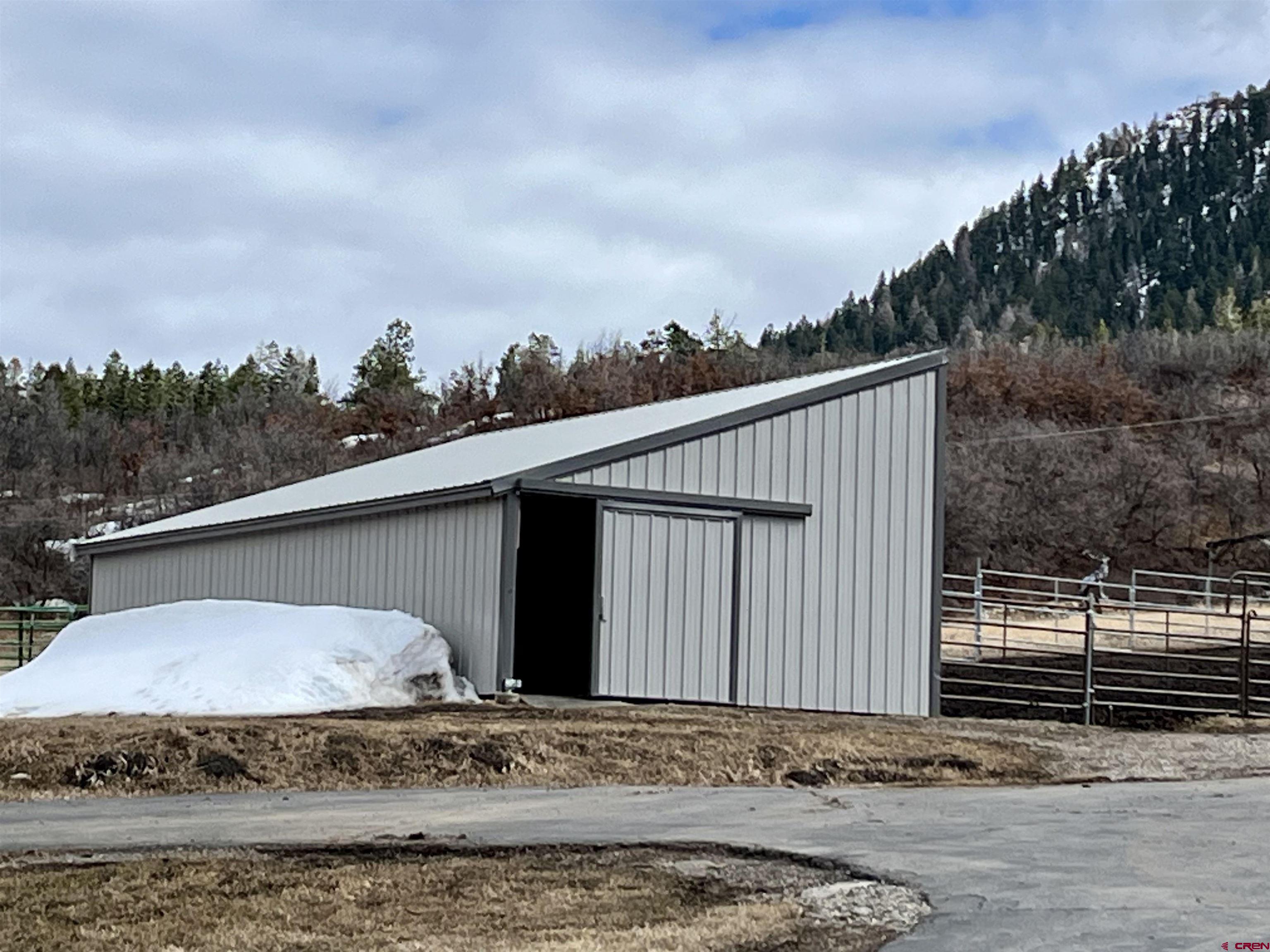 250 Sunset Lane Durango, CO 81301 - Photo 33 of 44 a view of a house with a wooden fence
