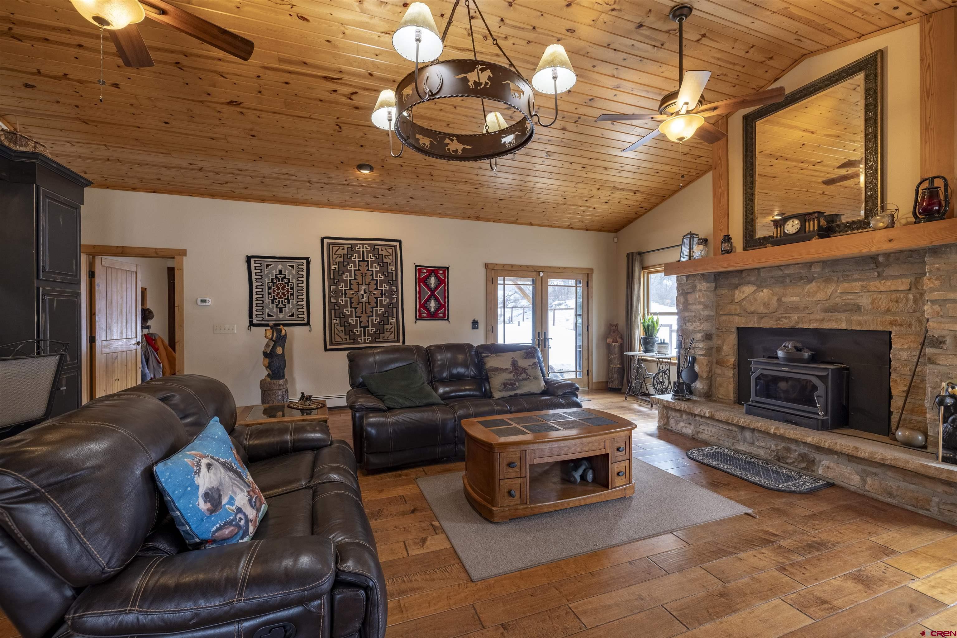 250 Sunset Lane Durango, CO 81301 - Photo 4 of 44 a living room with furniture and a fireplace