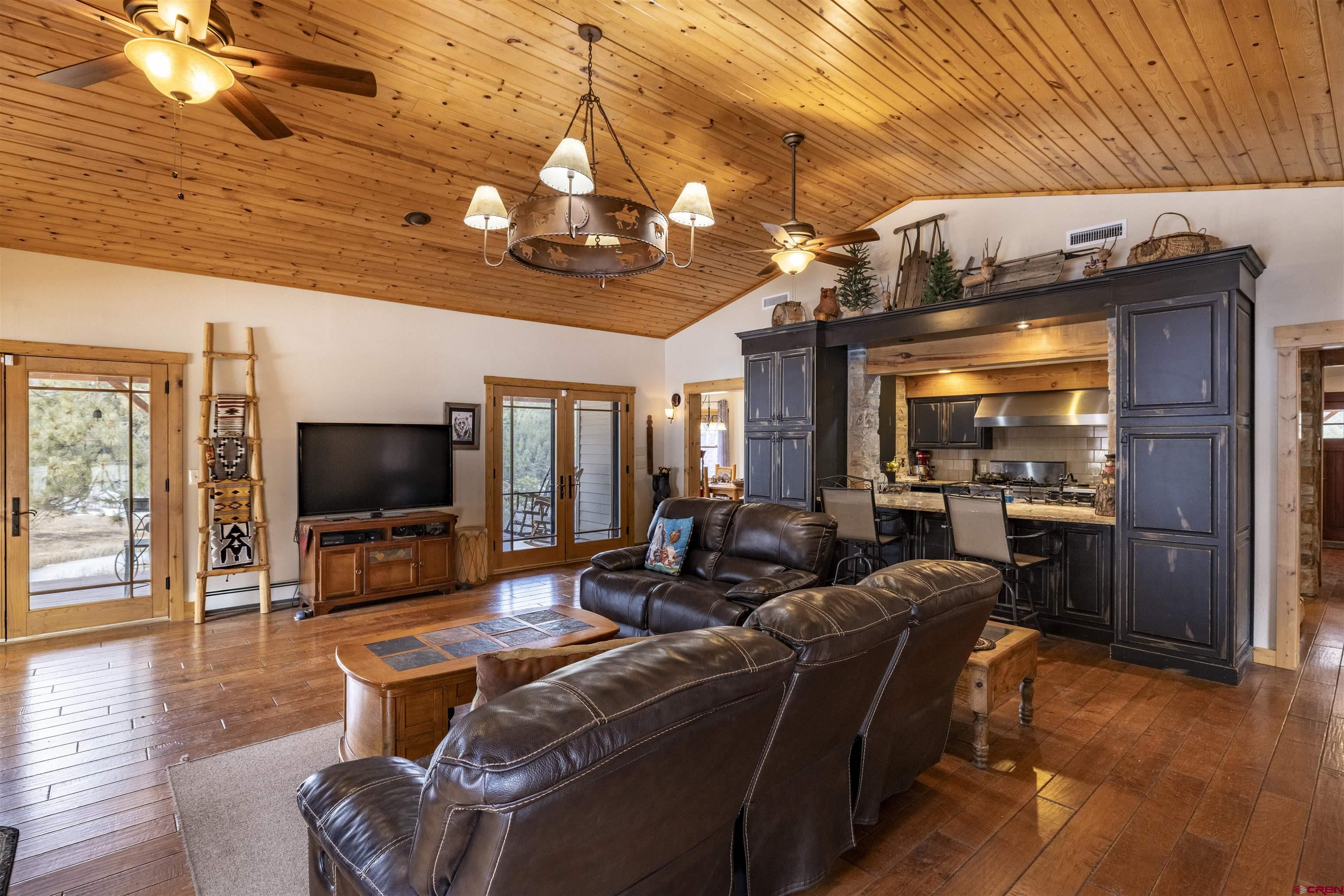 250 Sunset Lane Durango, CO 81301 - Photo 5 of 44 a living room with furniture and a flat screen tv
