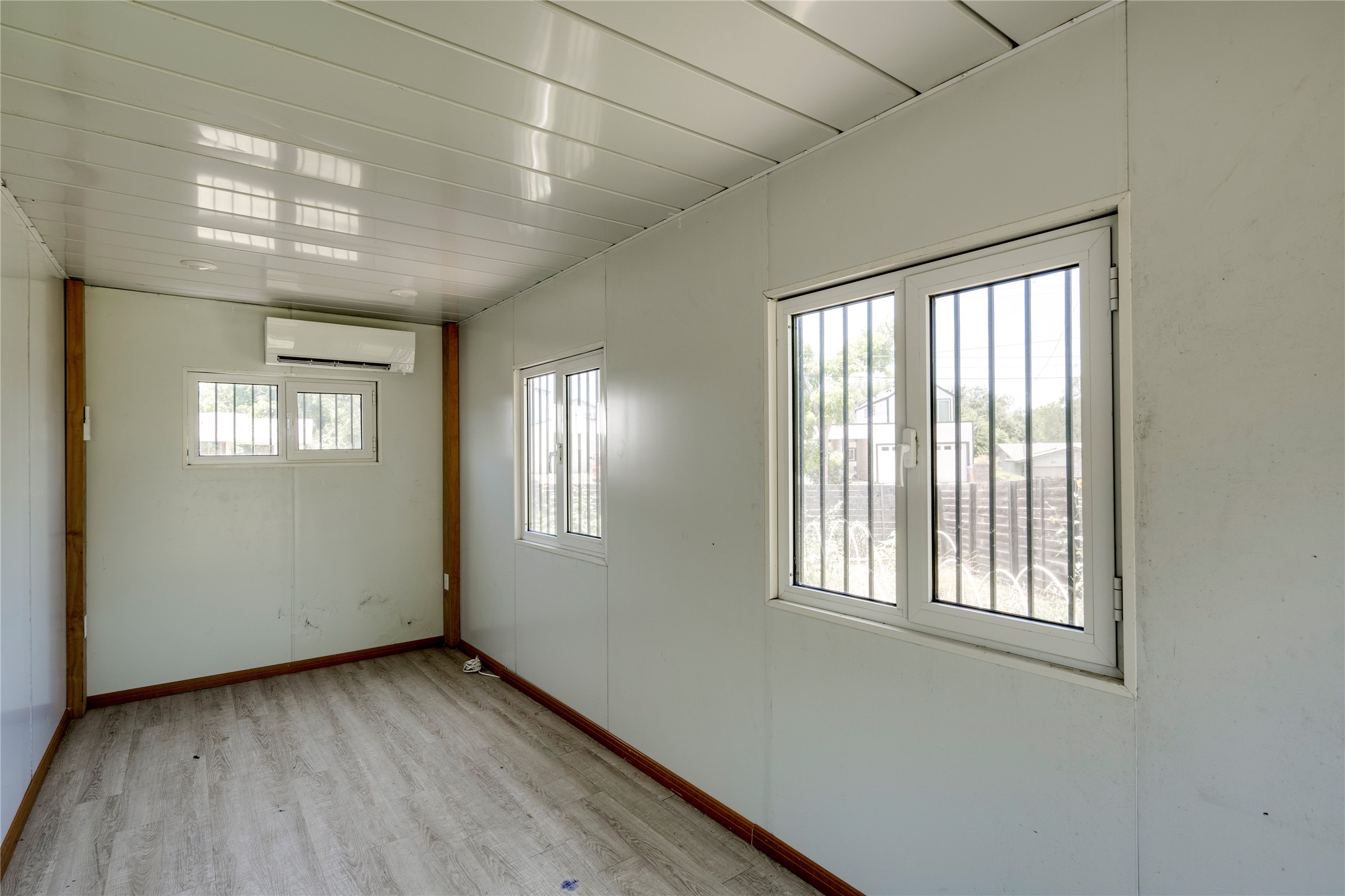 1707 Overhill Drive Austin, TX 78721 - Photo 20 of 36 Well-lit room offering durable vinyl flooring and functional windows.