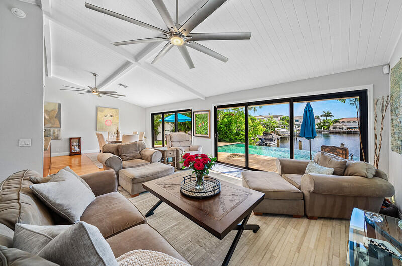 3026 Northeast 6th Drive Boca Raton, FL 33431 - Photo 13 of 49 a living room with furniture and a large window