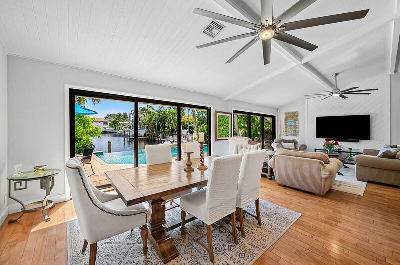 3026 Northeast 6th Drive Boca Raton, FL 33431 - Photo 18 of 49 a view of a dining room with furniture window and wooden floor