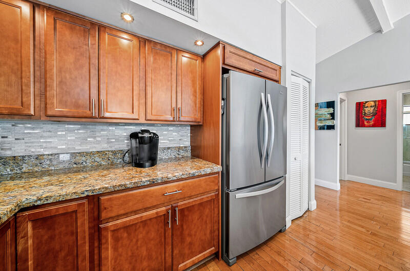 3026 Northeast 6th Drive Boca Raton, FL 33431 - Photo 24 of 49 a kitchen with stainless steel appliances granite countertop a refrigerator and a sink