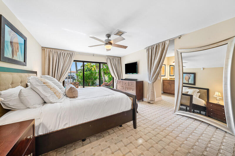 3026 Northeast 6th Drive Boca Raton, FL 33431 - Photo 25 of 49 a bedroom with a bed couch and a window