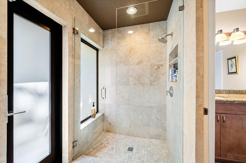 3026 Northeast 6th Drive Boca Raton, FL 33431 - Photo 29 of 49 a bathroom with a glass shower door
