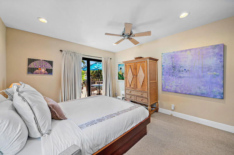 3026 Northeast 6th Drive Boca Raton, FL 33431 - Photo 34 of 49 a bedroom with a bed next to a window