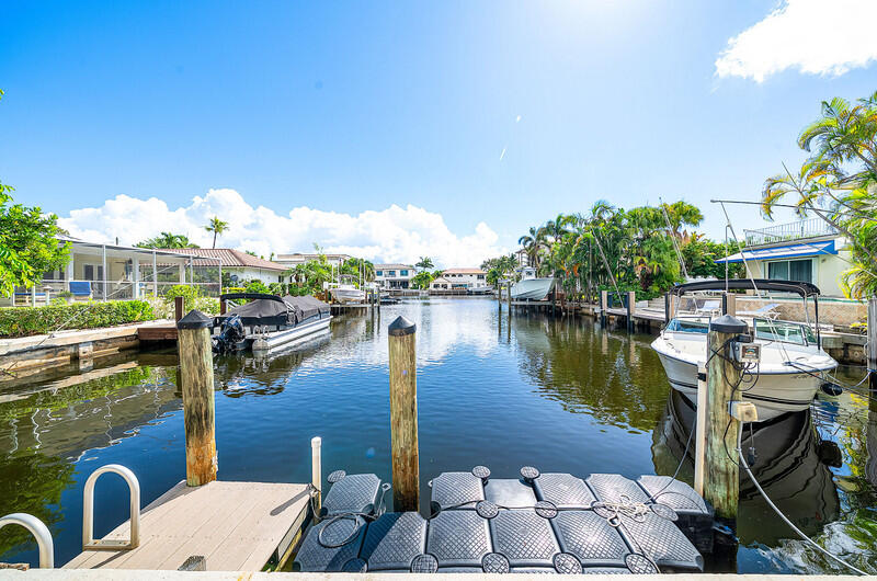3026 Northeast 6th Drive Boca Raton, FL 33431 - Photo 37 of 49 a view of a lake with sitting area