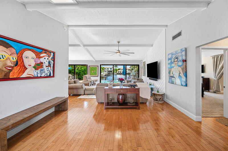 3026 Northeast 6th Drive Boca Raton, FL 33431 - Photo 45 of 49 a living room with furniture and a flat screen tv