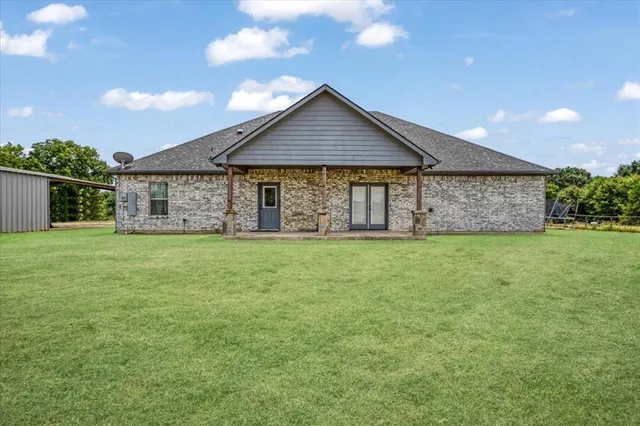 a front view of house with garden