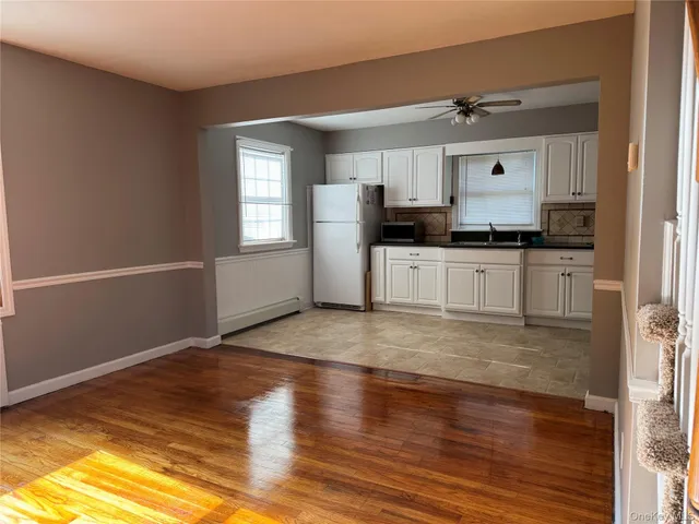 a kitchen with granite countertop a stove and a refrigerator