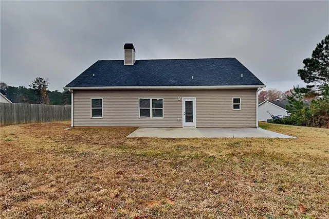 a house view with a backyard space