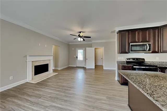 a view of a kitchen with a stove cabinets and wooden floor