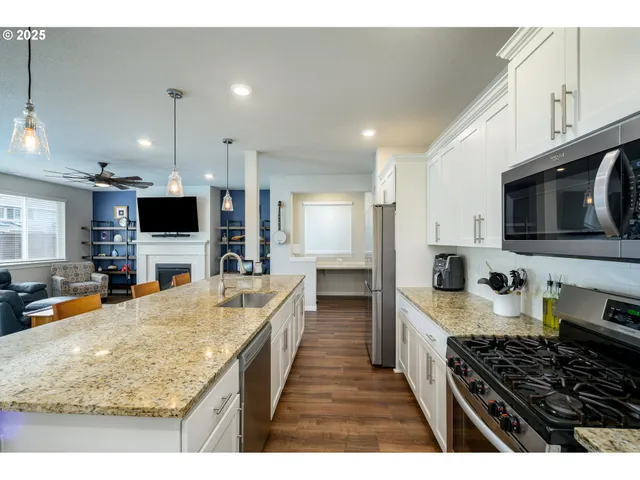 a view of a kitchen and dining room