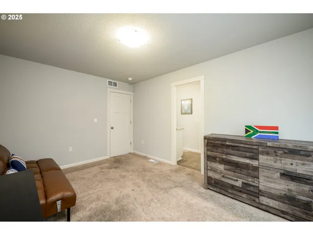 a view of a house with backyard sitting area and garden