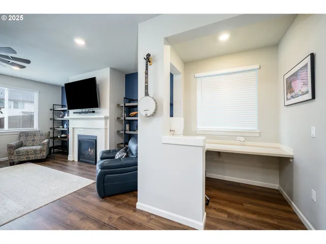 a kitchen with stainless steel appliances kitchen island granite countertop a refrigerator a stove a sink dishwasher with a dining table and chairs