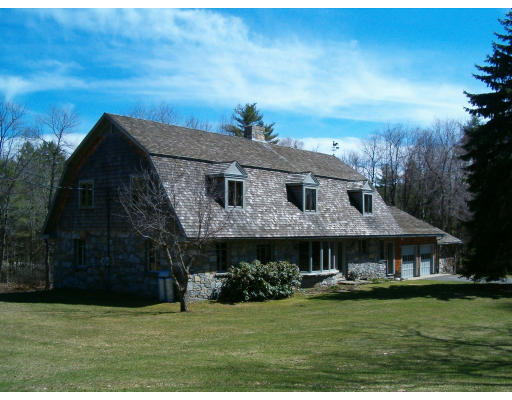 85 Buffam Road Pelham, MA 01002 - Photo 1 of 12 a front view of a house with garden
