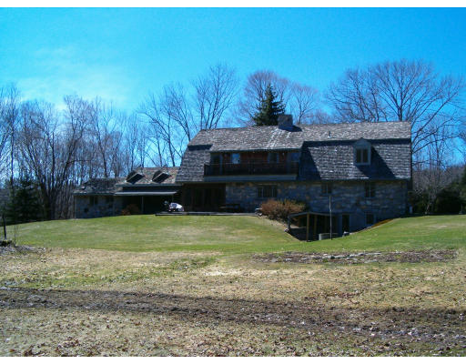 85 Buffam Road Pelham, MA 01002 - Photo 2 of 12 a view of a backyard with large trees