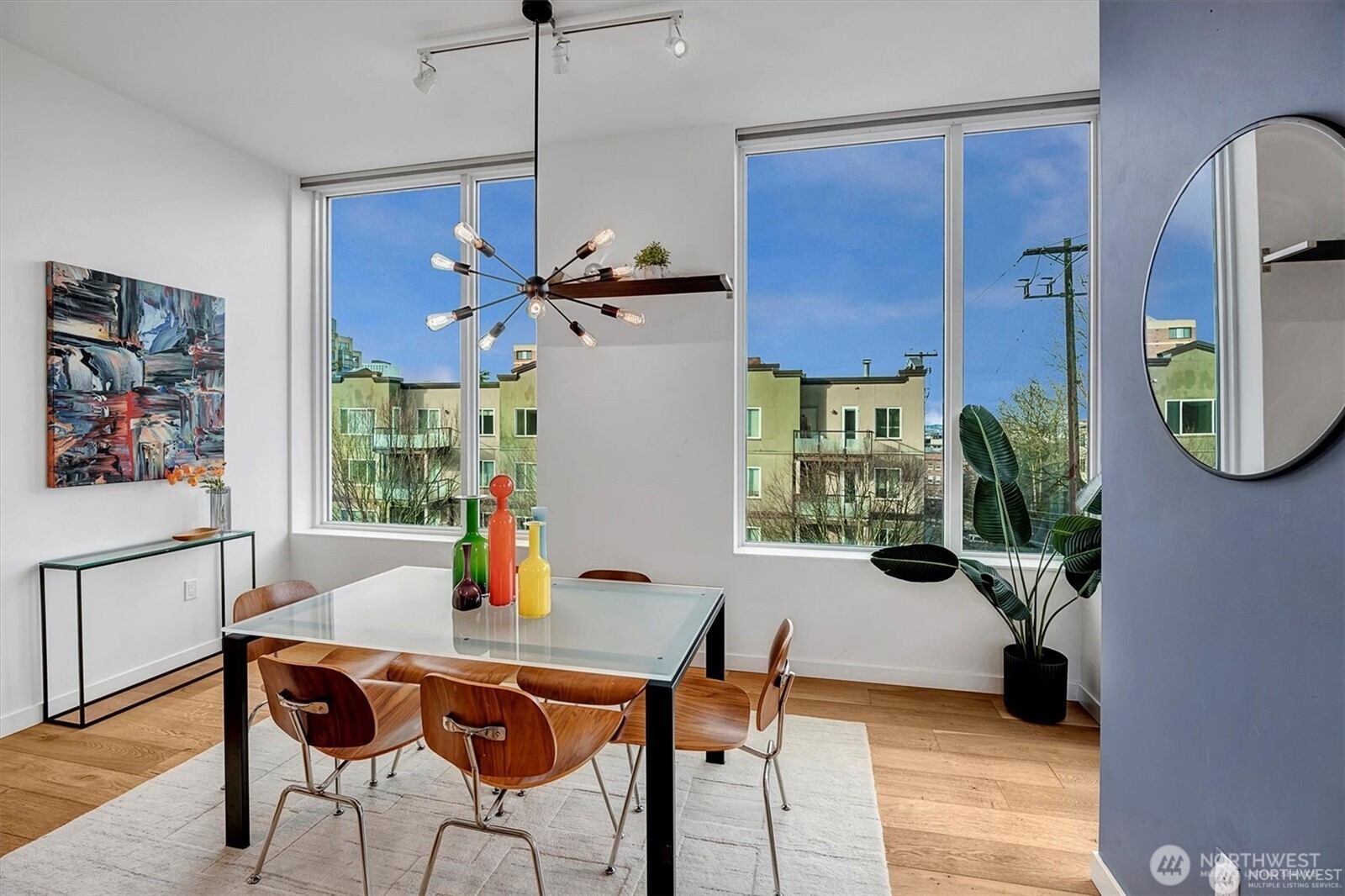 1321 Seneca Street, Unit 401 Seattle, WA 98101 - Photo 11 of 39 a view of a dining room with furniture and a potted plant