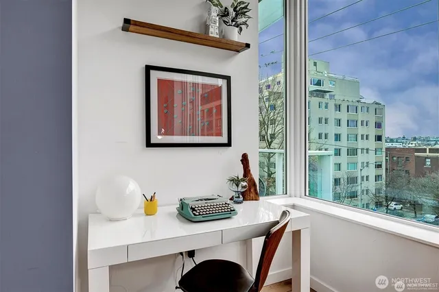 a view of a dining room with furniture and window