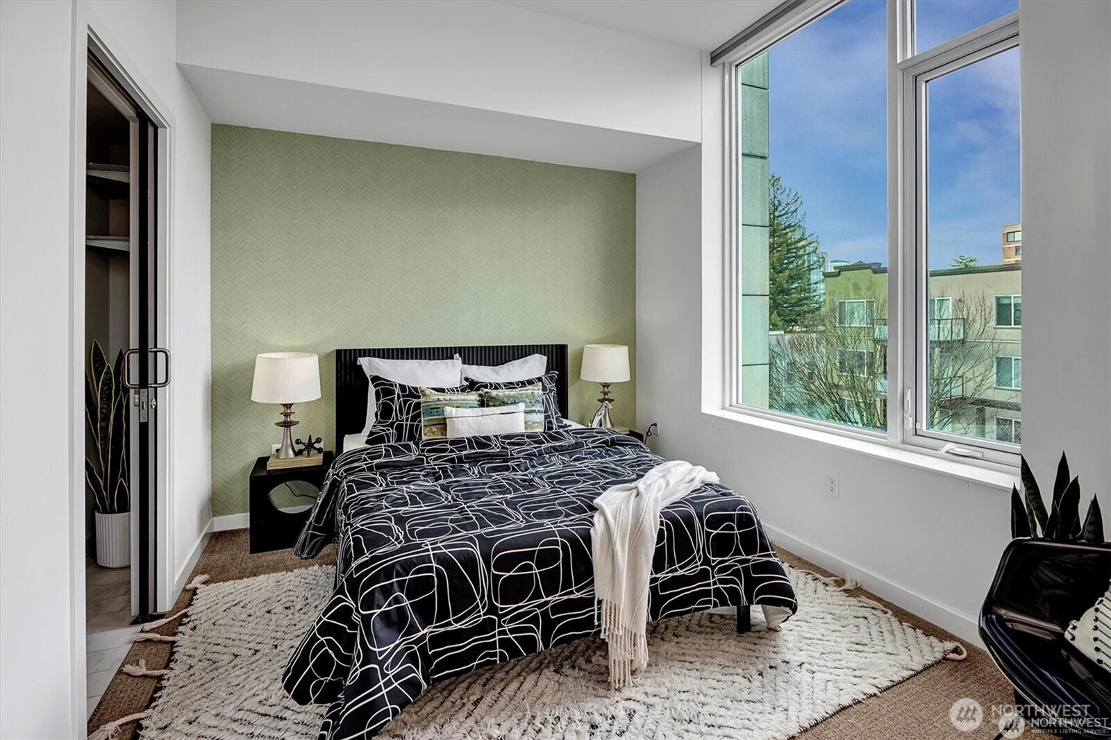 1321 Seneca Street, Unit 401 Seattle, WA 98101 - Photo 14 of 39 a bedroom with a bed and a window