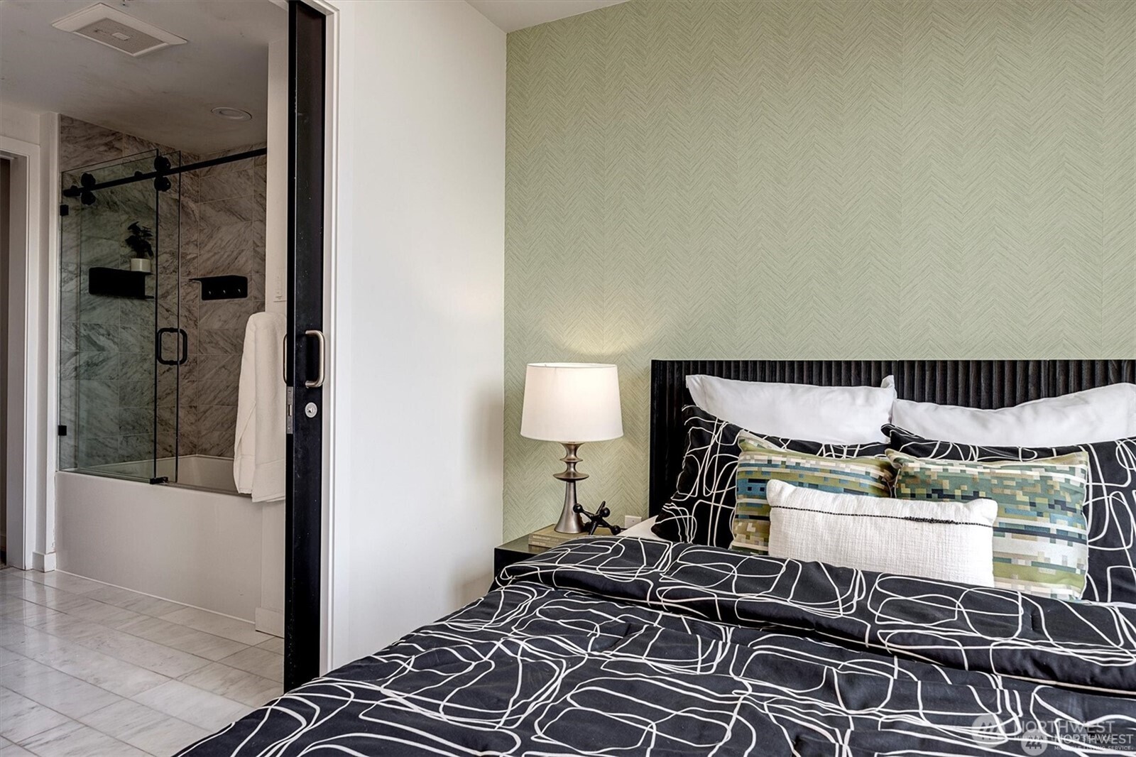 1321 Seneca Street, Unit 401 Seattle, WA 98101 - Photo 15 of 39 a bedroom with a bed and wooden floor