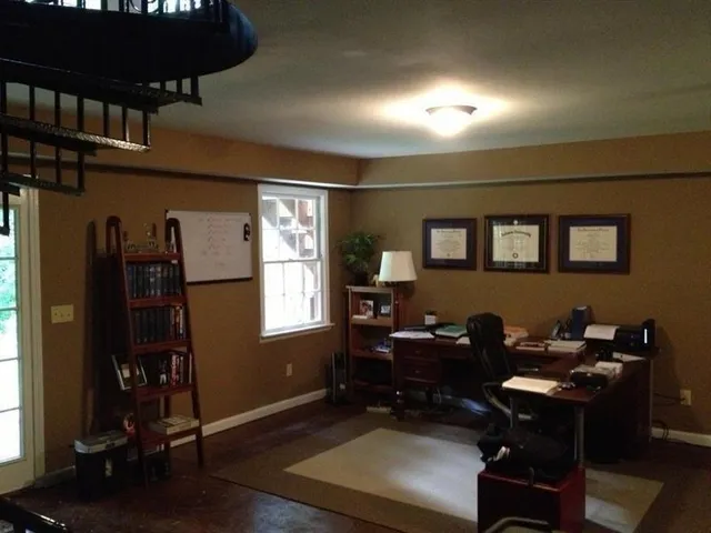 a view of balcony with wooden floor