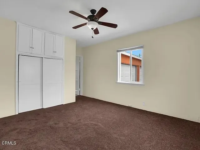 a view of a big room with carpet