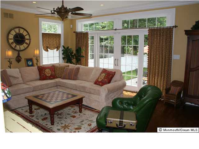 131 Black Point Road Rumson, NJ 07760 - Photo 3 of 3 a living room with furniture and a large window