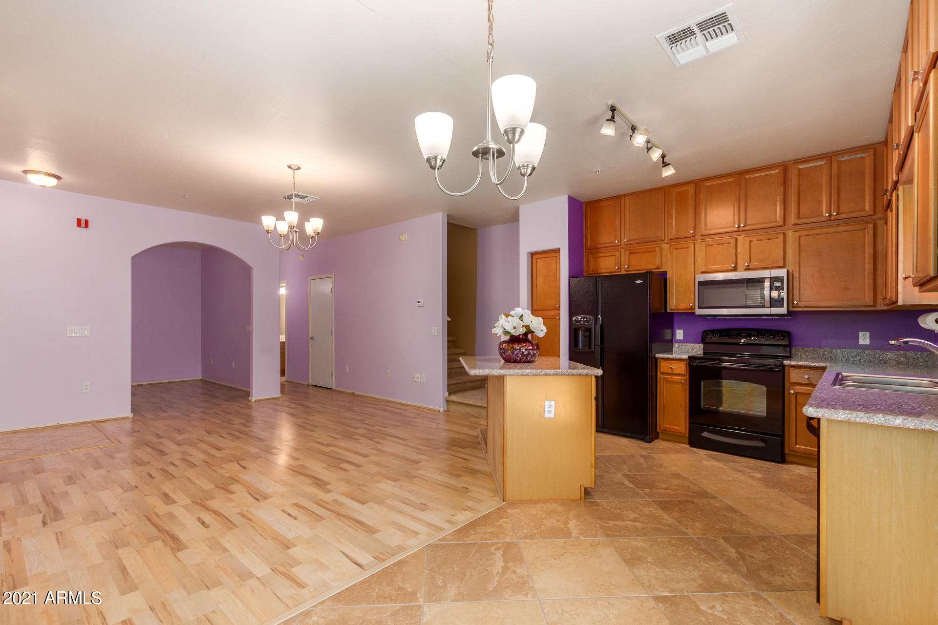 2150 East Bell Road, Unit 1162 Phoenix, AZ 85022 - Photo 1 of 24 a view of a kitchen with a sink and refrigerator