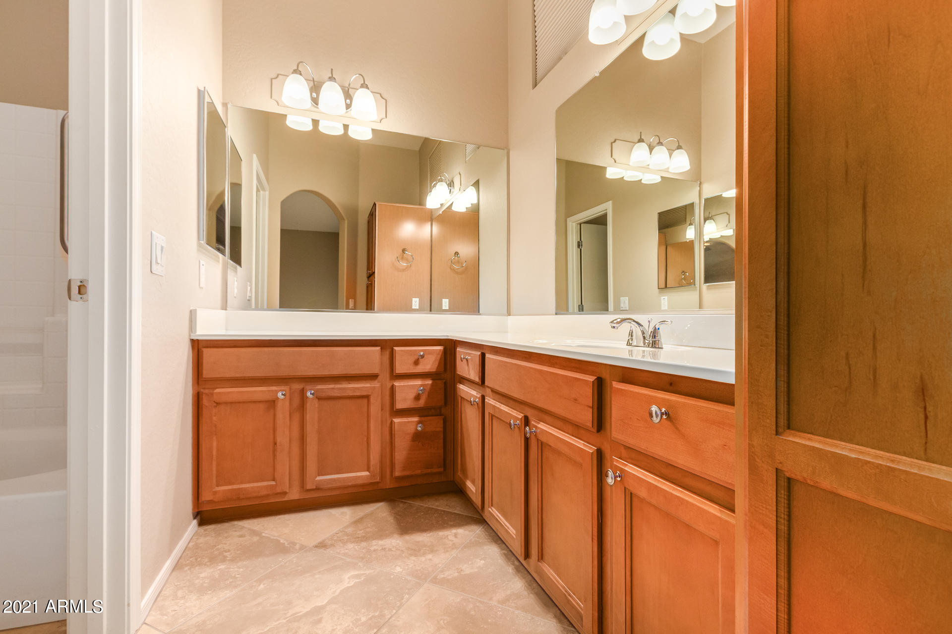 2150 East Bell Road, Unit 1162 Phoenix, AZ 85022 - Photo 13 of 24 a bathroom with a sink a vanity and a mirror