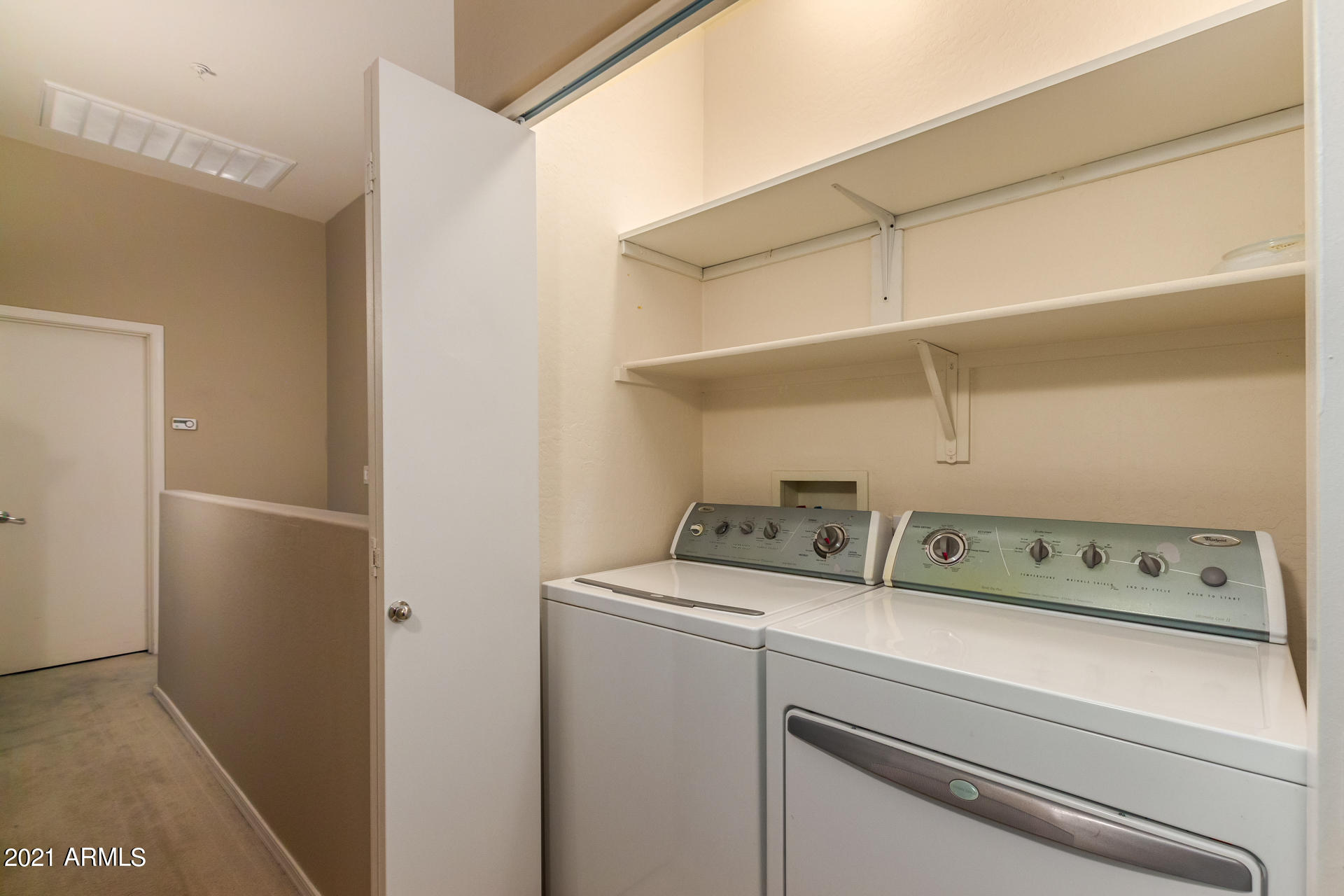 2150 East Bell Road, Unit 1162 Phoenix, AZ 85022 - Photo 18 of 24 a view of washer and dryer