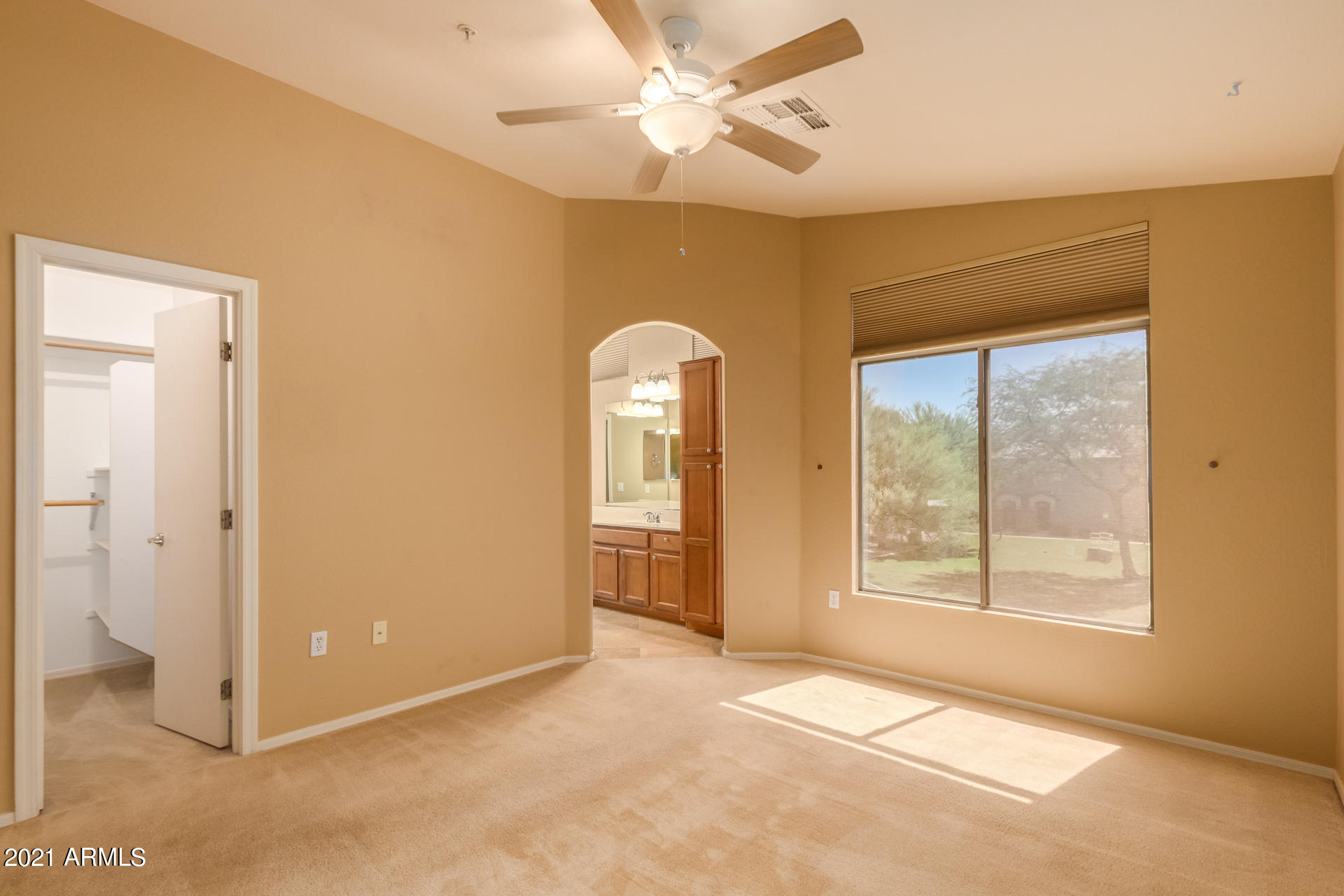 2150 East Bell Road, Unit 1162 Phoenix, AZ 85022 - Photo 9 of 24 an empty room with windows and closet