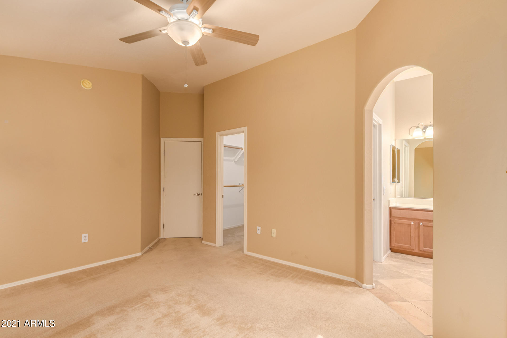 2150 East Bell Road, Unit 1162 Phoenix, AZ 85022 - Photo 10 of 24 a view of a room with a ceiling fan and bathroom