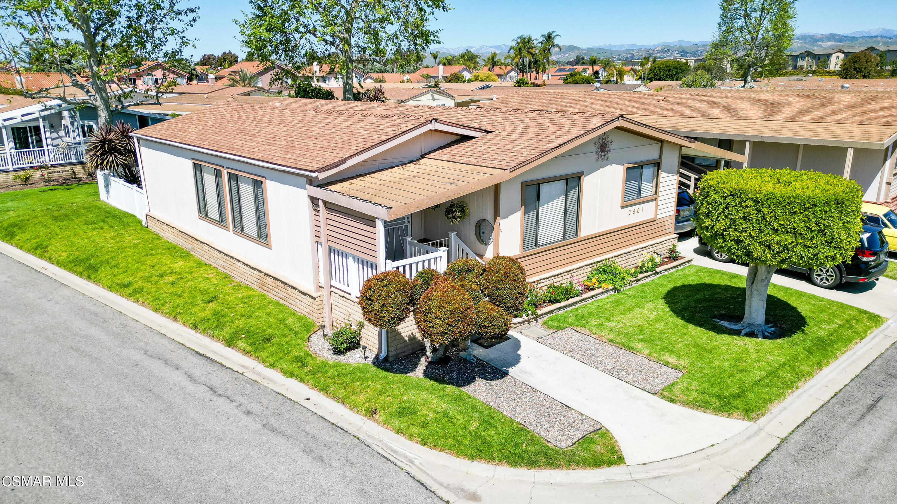 a aerial view of a house with garden and plants
