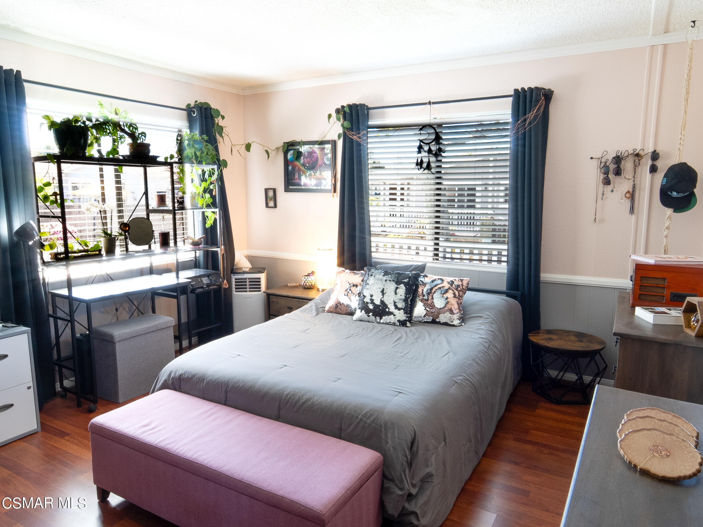 2501 Dogwood Drive, Unit 77 Oxnard, CA 93036 - Photo 14 of 32 a kitchen with a table chairs stove and wooden floor