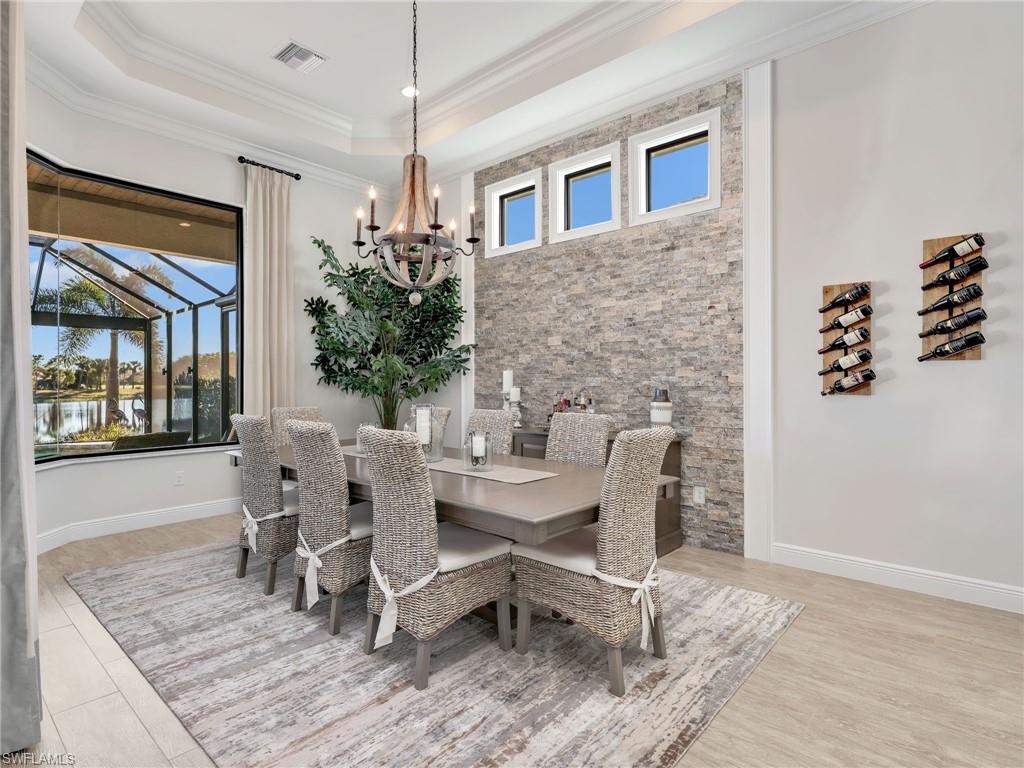 12757 Dundee Lane Naples, FL 34120 - Photo 16 of 48 a dining room with furniture and window