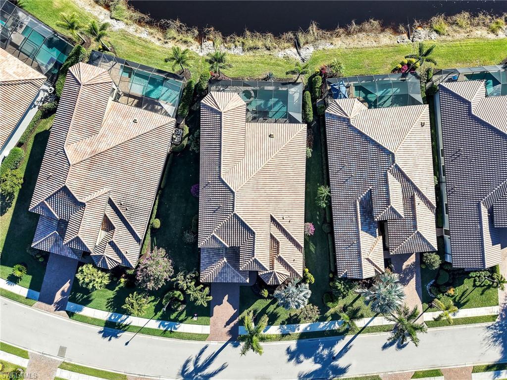 12757 Dundee Lane Naples, FL 34120 - Photo 2 of 48 an aerial view of multiple houses with a yard