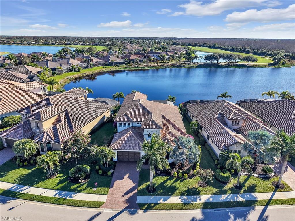 12757 Dundee Lane Naples, FL 34120 - Photo 3 of 48 an aerial view of a house with a lake view