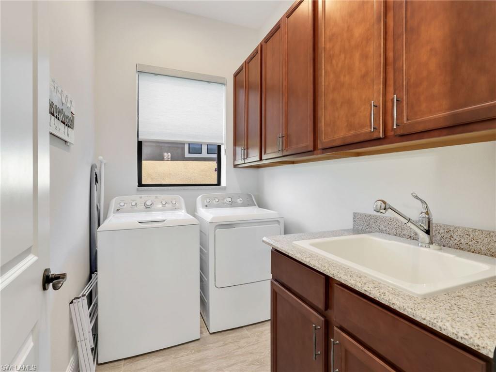 12757 Dundee Lane Naples, FL 34120 - Photo 34 of 48 a utility room with dryer and washer