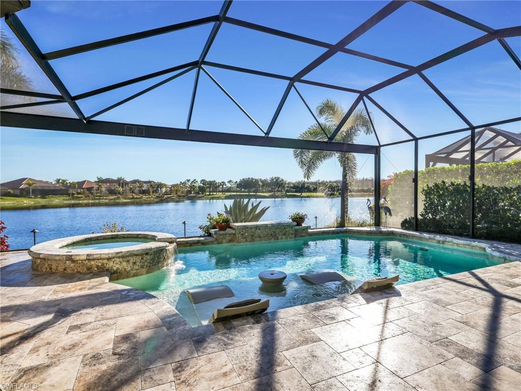 12757 Dundee Lane Naples, FL 34120 - Photo 38 of 48 a view of a swimming pool and lounge chairs in back yard