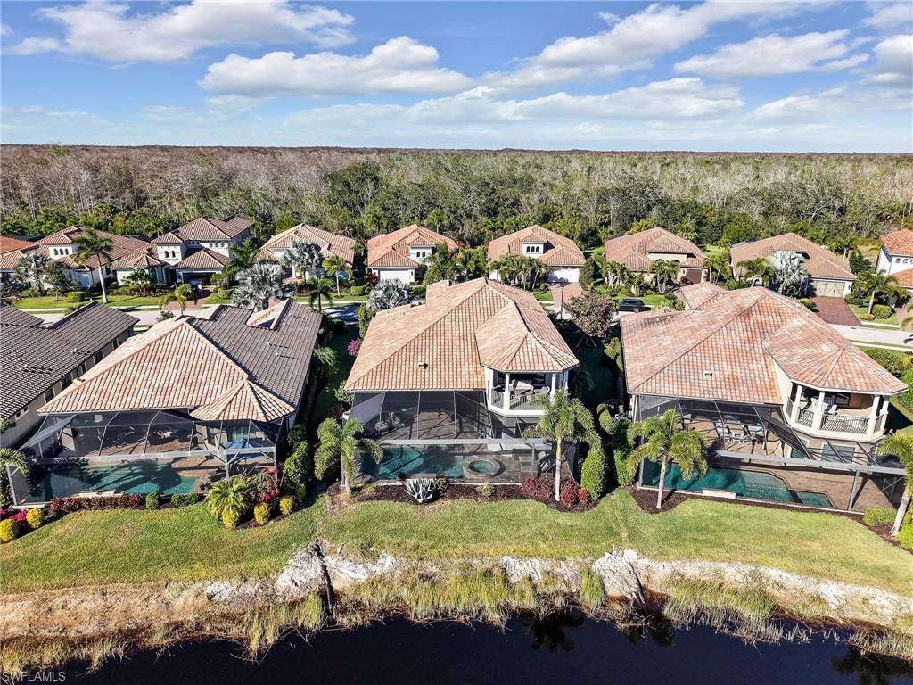 12757 Dundee Lane Naples, FL 34120 - Photo 4 of 48 a view of multiple houses with yard